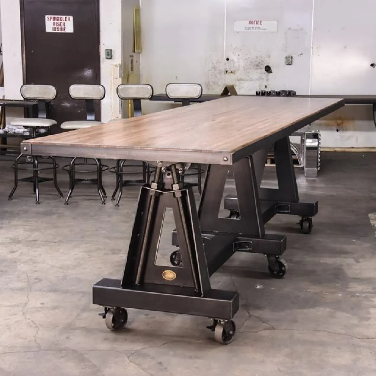 Industrial Style Conference Table with Wooden Top and Metal Base.