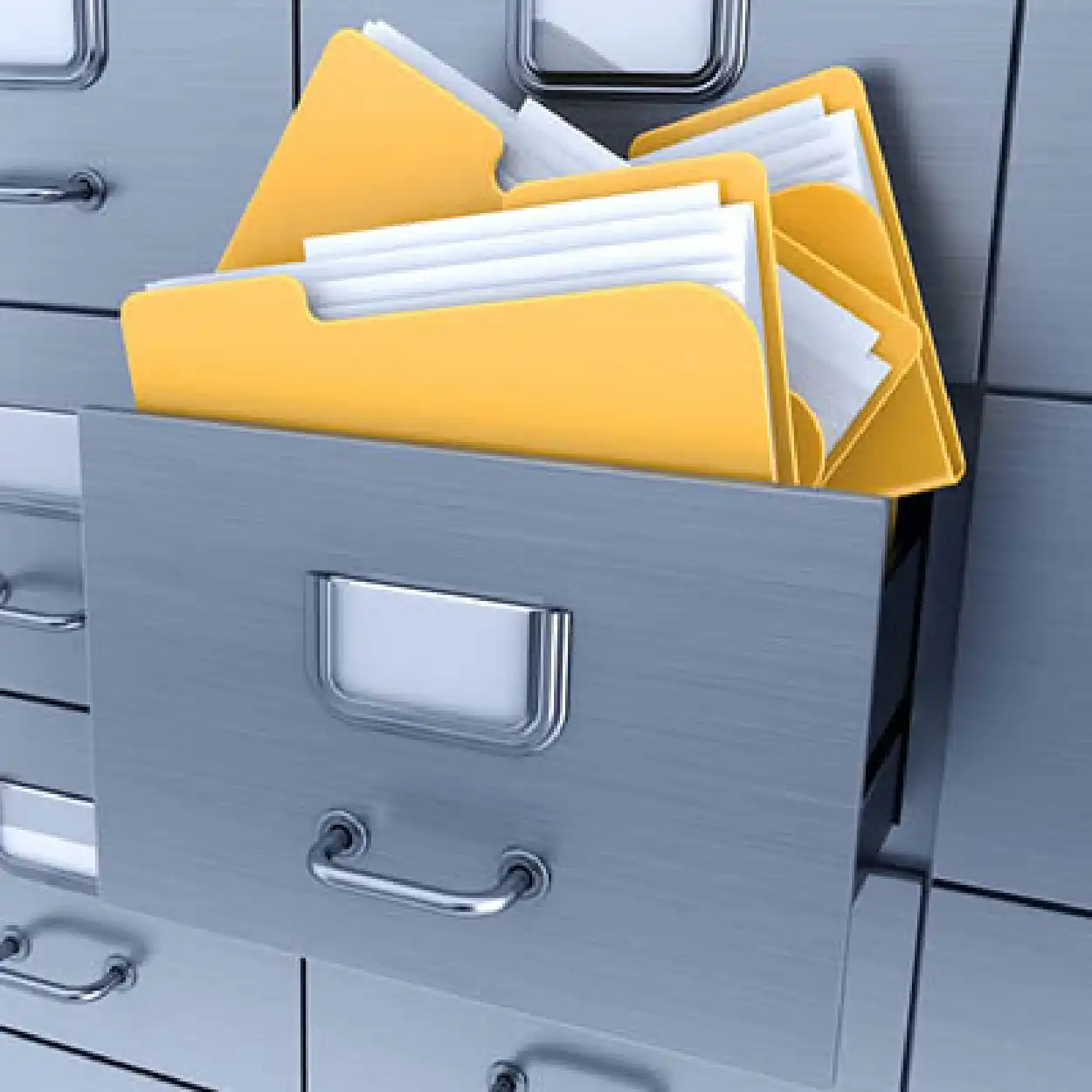 A metallic filing cabinet drawer with yellow folders containing papers.