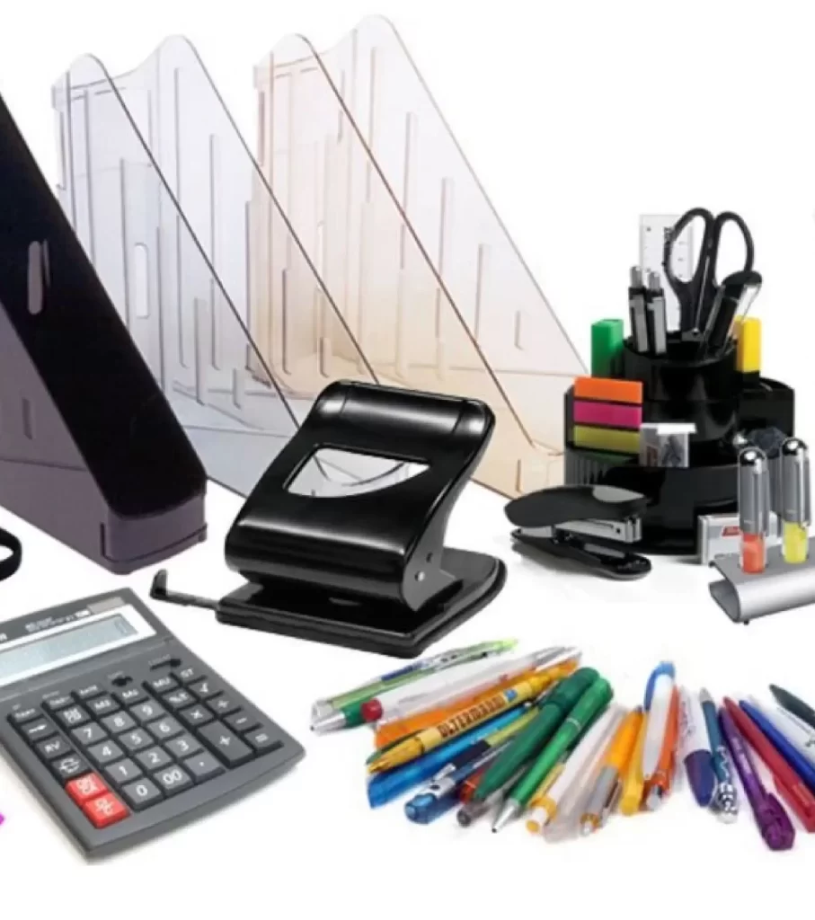 Various office stationery items including a calculator, a hole punch, pens, pencils, markers, a stapler, sticky notes, a pen holder with scissors, and file organizers.