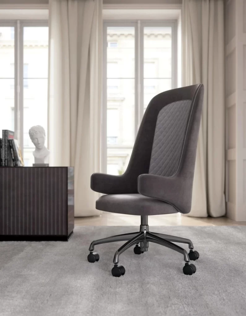 An ergonomic gray office chair with a high backrest on a modern carpeted floor.