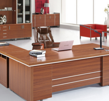 Brown wooden office furniture set up along with leather finished executive office chair.