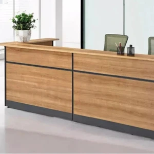 Modern wooden reception desk with sleek design and comfortable office chairs.