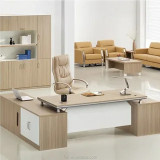 A stylish office setup featuring a sleek executive desk, ergonomic chair, and neutral-tone furniture.