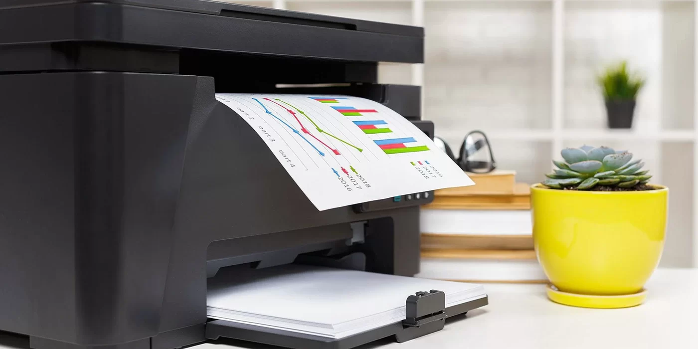 Desk printer ejecting a colorful chart printout.