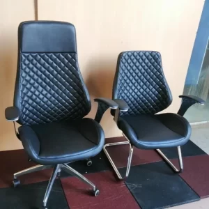 Two black office chairs with quilted backrest designs.