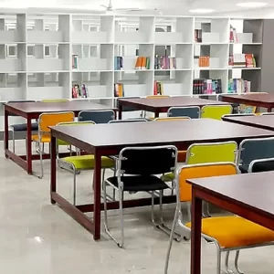 Modern Library Interior With Tables, Chairs, and Bookshelves