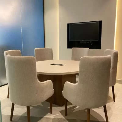 A round beige color wooden dining table.